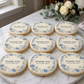 Decorative cookies with 'Thank You' messages on a marble surface.