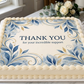 Sheet cake with 'Thank You for your incredible support' message on a marble surface.